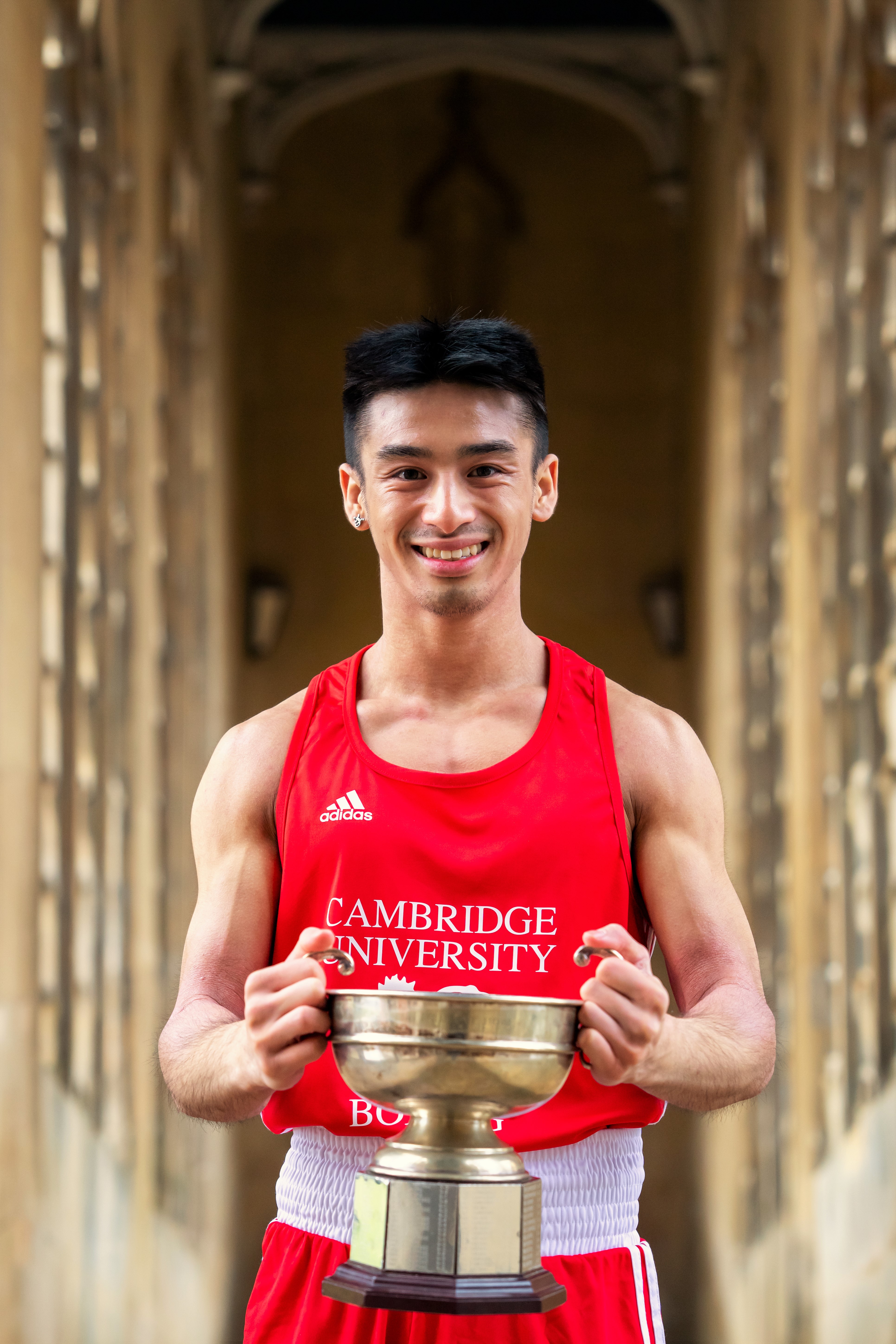 Will Tan with the Varsity boxing trophy