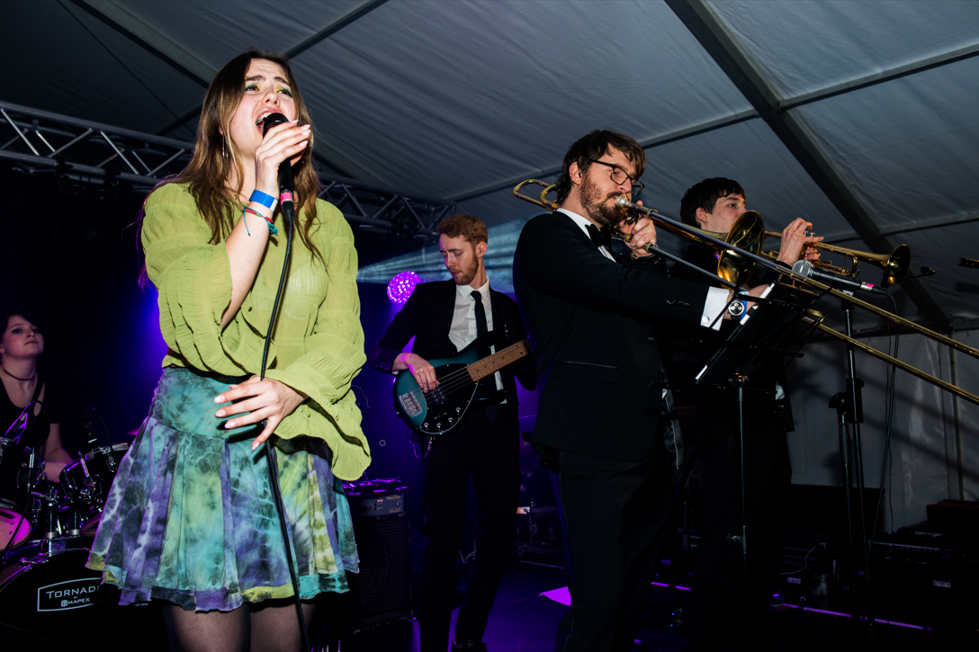 Student band Soft Crunchy Landing are pictured performing on stage, with St John's student Alice Markham pictured front, left.